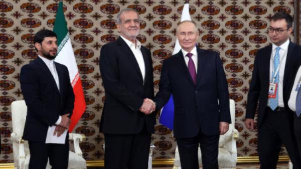 Russian President Vladimir Putin meets Iranian counterpart Masoud Pezeshkian on the sidelines of a cultural forum dedicated to the 300th anniversary of the birth of the Turkmen poet and philosopher Magtymguly Fragi, in Ashgabat, Turkmenistan October 11, 2024. Sputnik/Alexander Scherbak/Pool via REUTERS