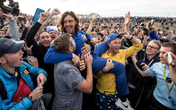 Team Europe portraits decorate the stands at practice - Mullets, drunken singing and F-bombs: The Ryder Cup is golf on steroids