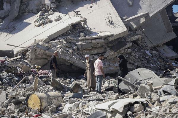 Palestinians sift through the rubble of their home in the wake of an Israeli air and ground offensive in Jebaliya, northern Gaza Strip after Israeli forces withdrew from the area. Picture: AP Photo/Enas Rami Palestinians sift through the rubble of their home in the wake of an Israeli air and ground offensive in Jebaliya, northern Gaza Strip after Israeli forces withdrew from the area. Picture: AP Photo/Enas Rami
