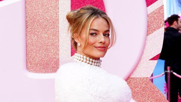 Margot Robbie leads stars at Golden Globes wearing 1977 Superstar Barbie ensemble
