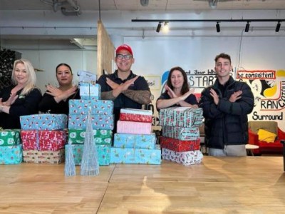 Santana and Tyrone deliver gifts to kids at Middlemore Hospital with their son Easton.