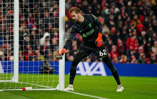 Liverpool goalkeeper Caoimhin Kelleher removes a pie that was thrown from the pitch. Photo credit: Peter Byrne/PA Wire. Liverpool goalkeeper Caoimhin Kelleher removes a pie that was thrown from the pitch. Photo credit: Peter Byrne/PA Wire.