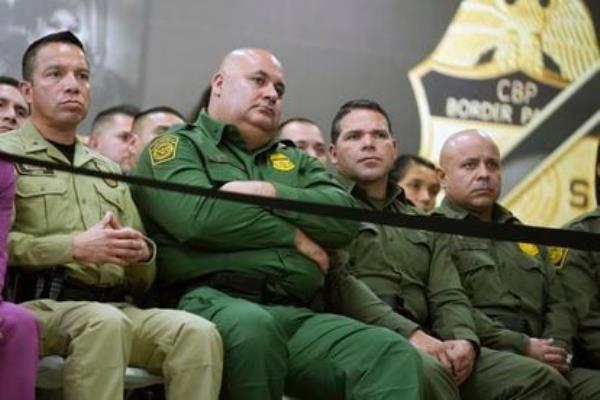 Border Patrol agents listen to Biden's speech Feb. 29 at the Brownsville station.