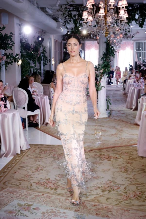 A model walking the runway in a dress at the S/S 2025 LoveShackFancy fashion show during New York Fashion Week