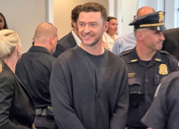 Timberlake smiling after entering court Friday.
