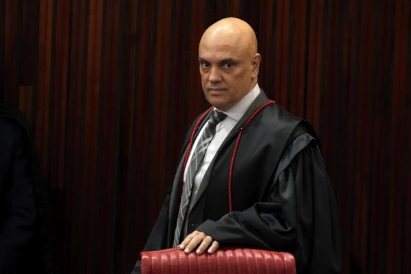 Man in black legal robes in court.
