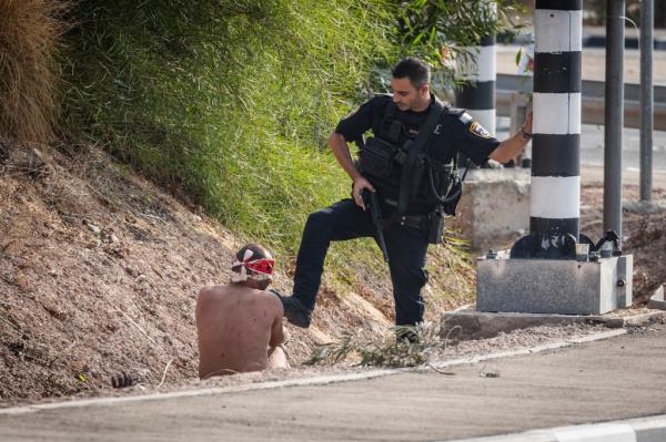 A Palestinian man arrested on the side of a road on the second day of the ongoing conflict between Israel and the Palestinian militant group Hamas.