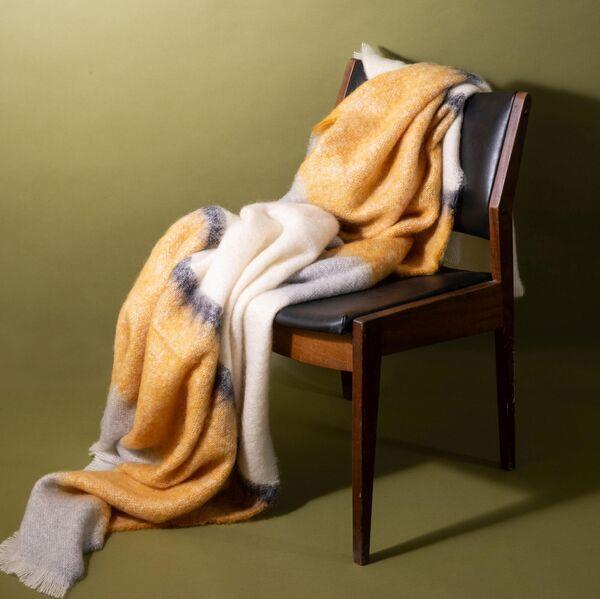 The Silare ochre mohair throw from The Irish Design Shop is made by Cushendale (€245). The Silare ochre mohair throw from The Irish Design Shop is made by Cushendale (€245).