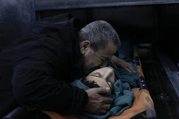 A relative mourns 15-year-old Basil Abu Al-Wafa, who was killed during an Israeli military raid on Jenin refugee camp in the West Bank on Wednesday, November 29. Picture: AP Photo/Majdi Mohammed A relative mourns 15-year-old Basil Abu Al-Wafa, who was killed during an Israeli military raid on Jenin refugee camp in the West Bank on Wednesday, November 29. Picture: AP Photo/Majdi Mohammed