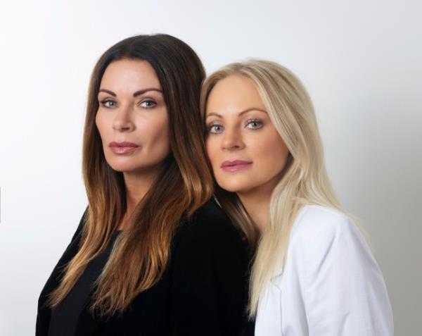 Lisa leaning on Carla in a Coronation Street promo picture
