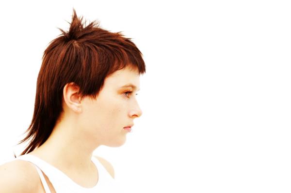 Young woman looking to the side.