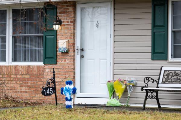Flowers outside Levittown, Pa. house where the murder took place.