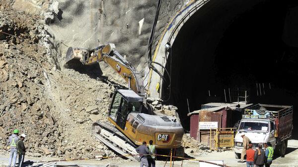 Rescuers change approach in bid to reach 41 workers trapped in Indian tunnel