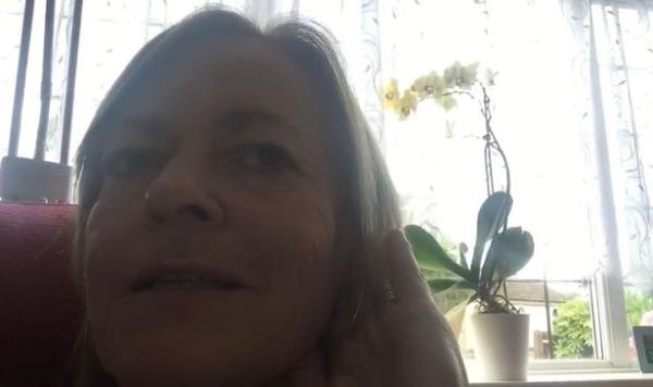 Georgina sitting down filming herself