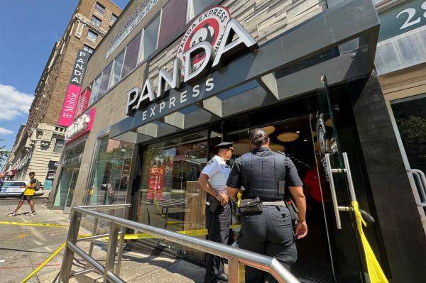 Police at the scene of where two teen boys were stabbed inside a Panda Express restaurant in Manhattan on Aug. 10, 2024.