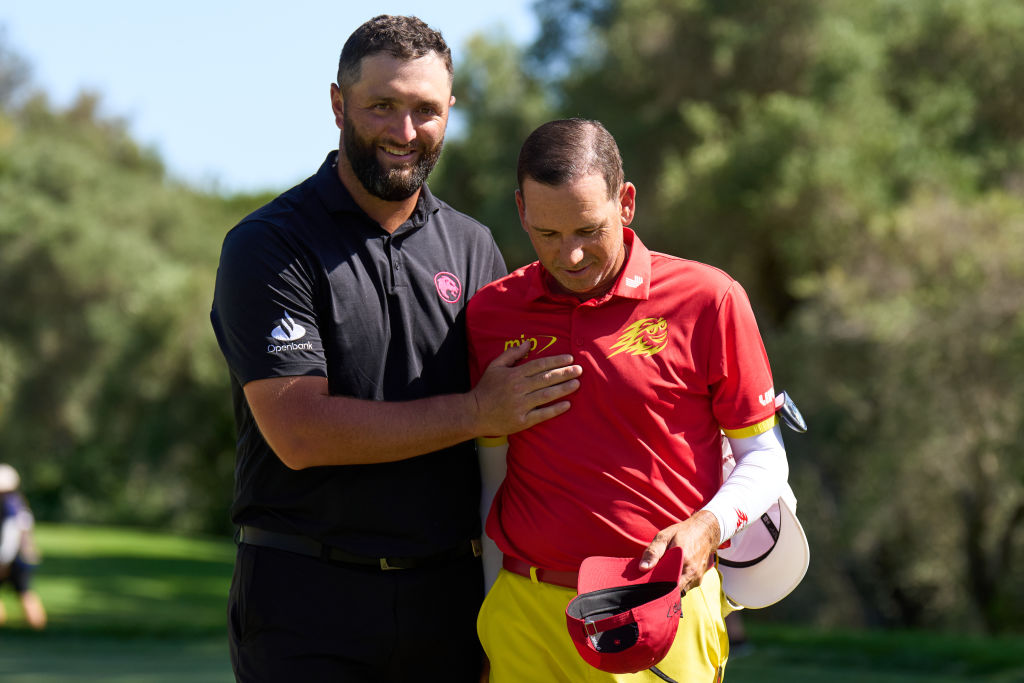 Jon Rahm of Legion XIII embraces Sergio Garcia of Fireballs GC on the third hole during day three of the LIV Golf Andalucia