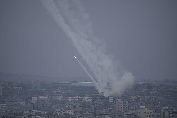 Rockets are fired towards Israel from the Gaza Strip on Monday, Oct. 9, 2023. (AP Photo/Hatem Moussa)