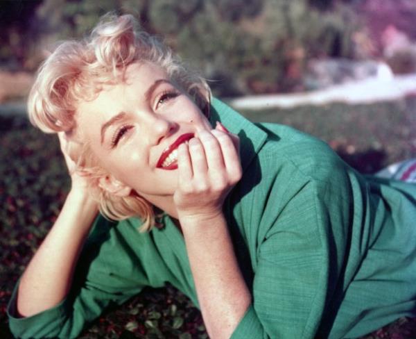 Marilyn Monroe poses for a portrait laying on the grass in 1954 in Palm Springs, California. (Photo by Baron/Hulton Archive/Getty Images)