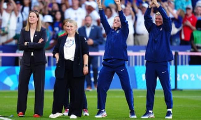 Emma Hayes (second left) and her coaching staff celebrate after beating Brazil in Paris