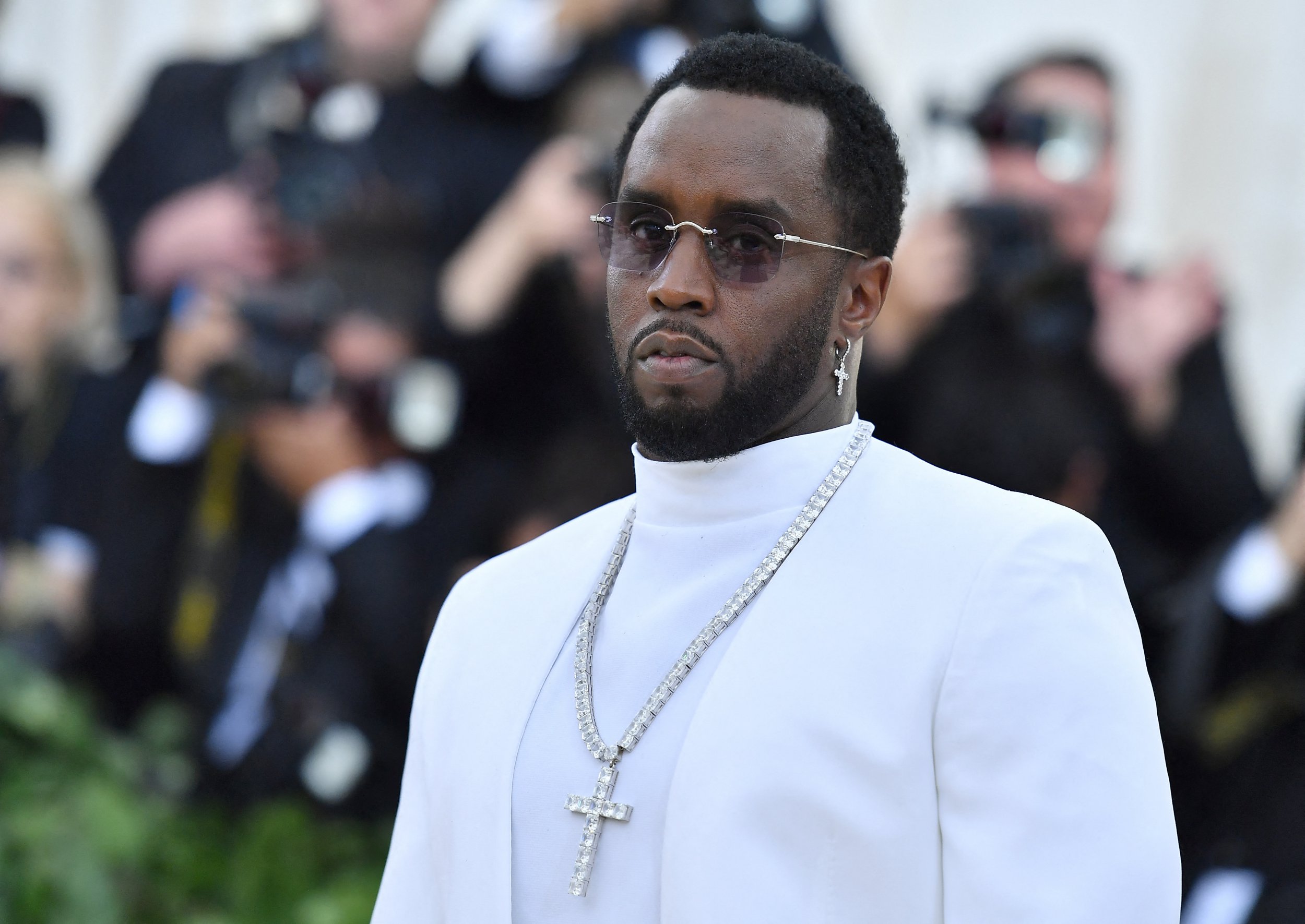 Sean Combs 'P. Diddy' poses for a photo at the met gala in a white suit