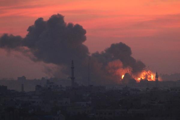Explosion and smoke caused by Israeli raids seen on October 11 in Gaza City.
