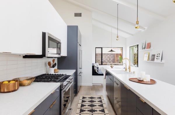 All white kitchen with slanted ceiling, gray-blue cabinetry