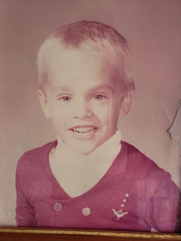 A grainy photo of a young boy.