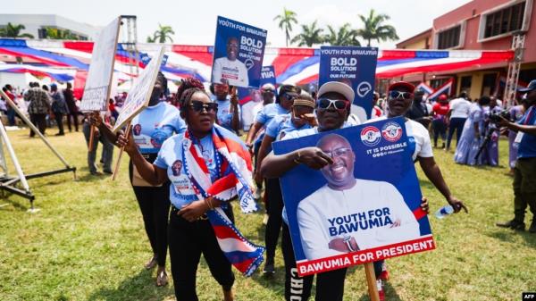 Supporters hold a placard depicting Mahamudu Bawumia, vice president of Ghana and presidential candidate of the New Patriotic Party NPP for the 2024 presidential elections, in Takoradi, Ghana, Aug. 18, 2024.
