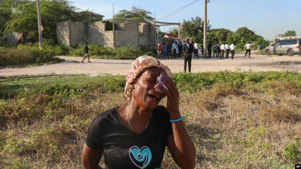 A woman cries during the funeral of a neighbor who was killed during an attack by armed gangs in Pont-Sonde, Haiti, on Oct. 8, 2024. The second-in-command of one of Haiti's most powerful gangs was injured in a police shootout, authorities said on Oct. 15, 2024.