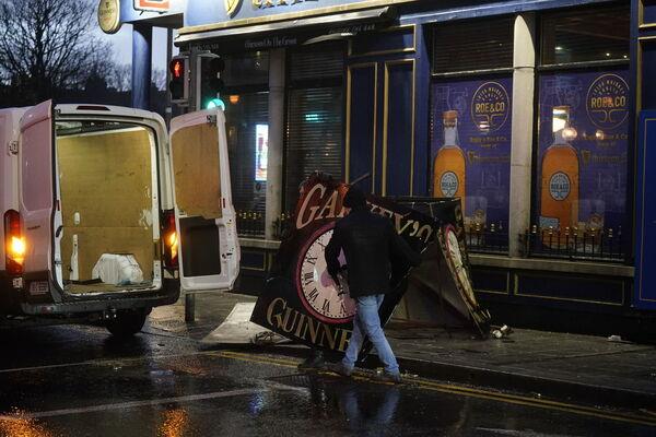 A clock tower falls to the ground in Eyre Square, Galway, during Storm Isha. Picture: Niall Carson/PA Wire A clock tower falls to the ground in Eyre Square, Galway, during Storm Isha. Picture: Niall Carson/PA Wire
