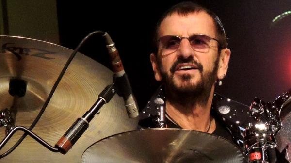 Steve Lukather, Warren Ham, and Ringo Starr on stage