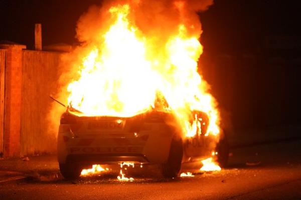 Violent disorder erupted in Hartlepool as a police car was burned by rioters