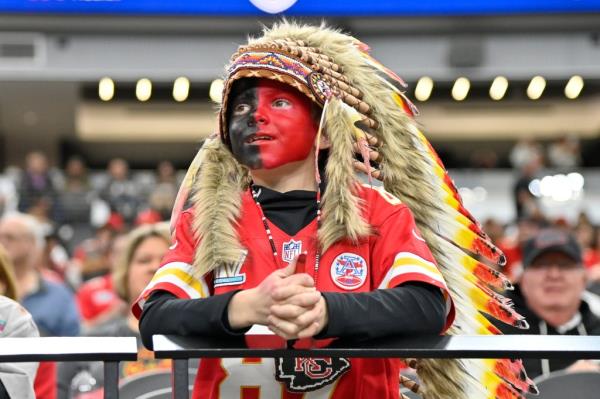 Holden Armenta wore a Chiefs jersey to the game, with his face painted half-red and half-black, and a costume Native American headdress.