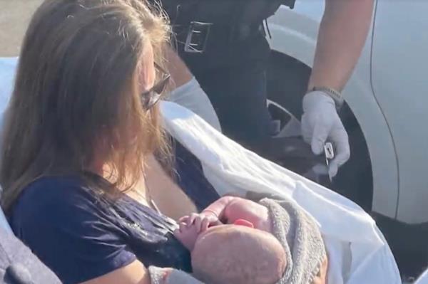 The couple was driving to the hospital when she went into labor.