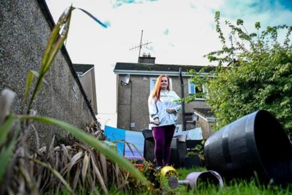  ‘I never thought I’d be afraid of the sound of raindrops,’ says Jessica Daly, near the spot where she watched the water rip through the wall in her back garden at Beechwood Drive, Midleton. Picture: Chani Anderson
