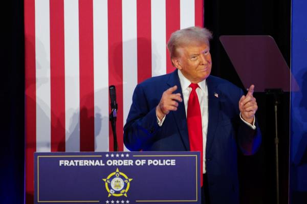 Republican presidential nominee and former U.S. President Donald Trump gestures as he addresses the Fraternal Order of Police at their meeting in Charlotte, North Carolina, U.S. September 6, 2024.