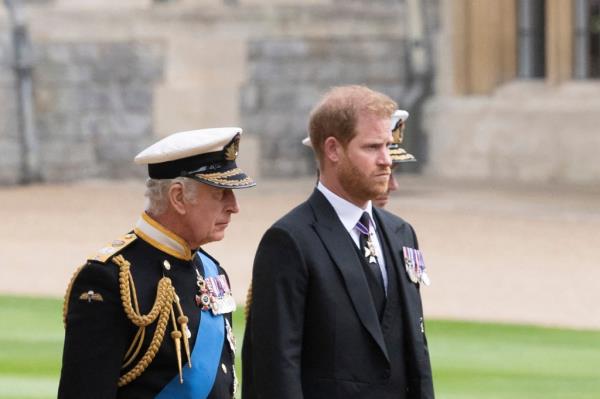 King Charles walks with Prince Harry
