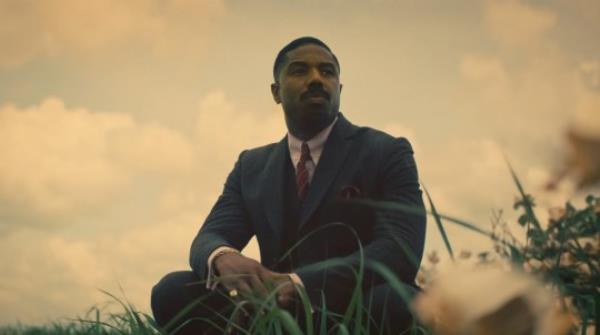Michael B Jordan in a suit