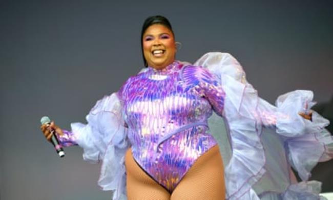 Lizzo performing in a bodysuit 