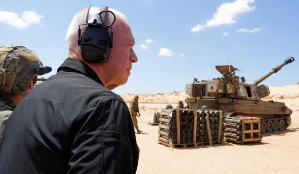Israeli Defence Minister Yoav Gallant standing with soldiers by a self-propelled artillery howitzer during a visit to a position along the border with the Gaza Strip in southern Israel near Rafah. (AFP file photo)