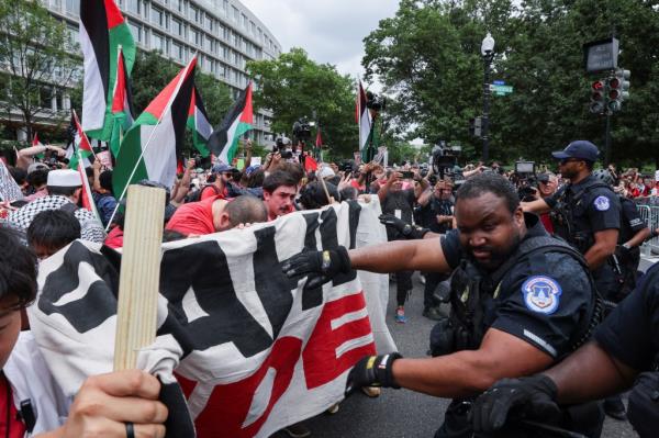 U.S. Capitol police officer reacting to pepper spray during a clash with pro-Palestinian protesters as Israeli PM Netanyahu addresses Congress, Washington D.C., July 24, 2024