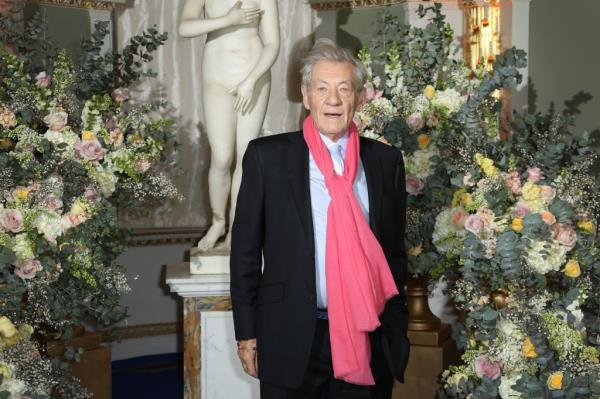 Sir Ian McKellen poses for photographers ahead of a screening for the Beauty And The Beast Premiere, in London, Thursday, Feb. 23, 2017.