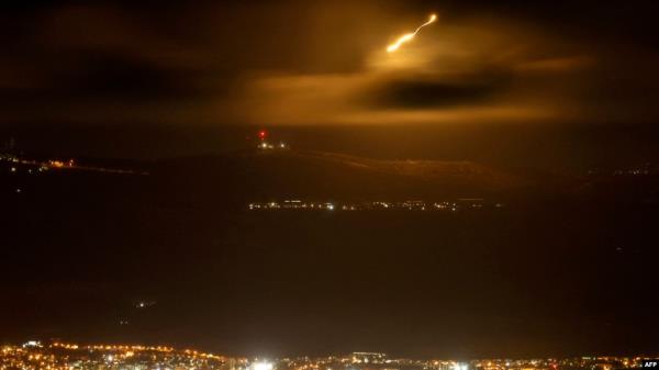 Israeli army flares light up the sky along the border with Lebanon late on Sept. 15, 2024 amid escalations in the ongoing cross-border tensions as fighting continues between Israel and Hamas militants in the Gaza Strip.