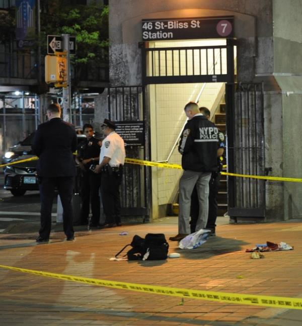 Police on the scene where a person was stabbed on the street of the 46 St. Bliss Street station of the #7 train on Wednesday, May 8, 2024. (Sam Costanza for the New York Daily News)