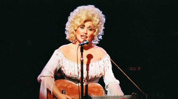 Dolly Parton younger playing guitar