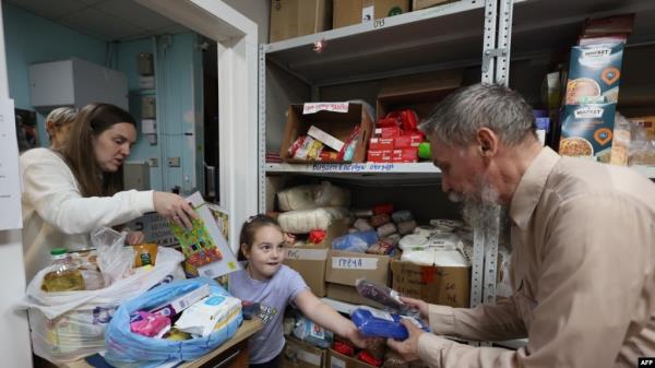 Refugees receive humanitarian aid from a collection station in Moscow on Aug. 13, 2024, following Ukraine's offensive into Russia's western Kursk region. On Aug. 6, 2024, Ukraine launched a surprise offensive into the Russian border region of Kursk.