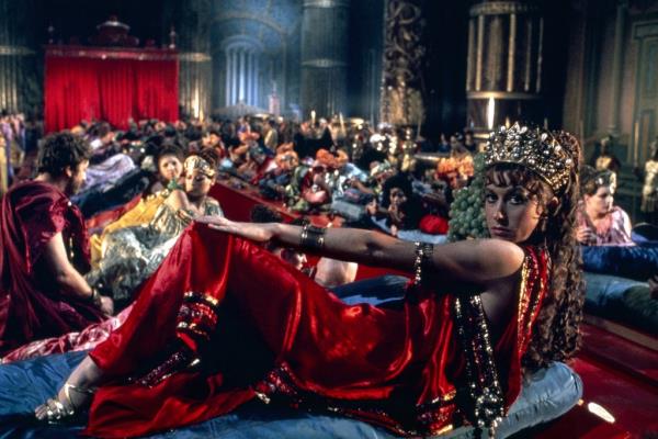Helen Mirren sprawled out at a Roman party