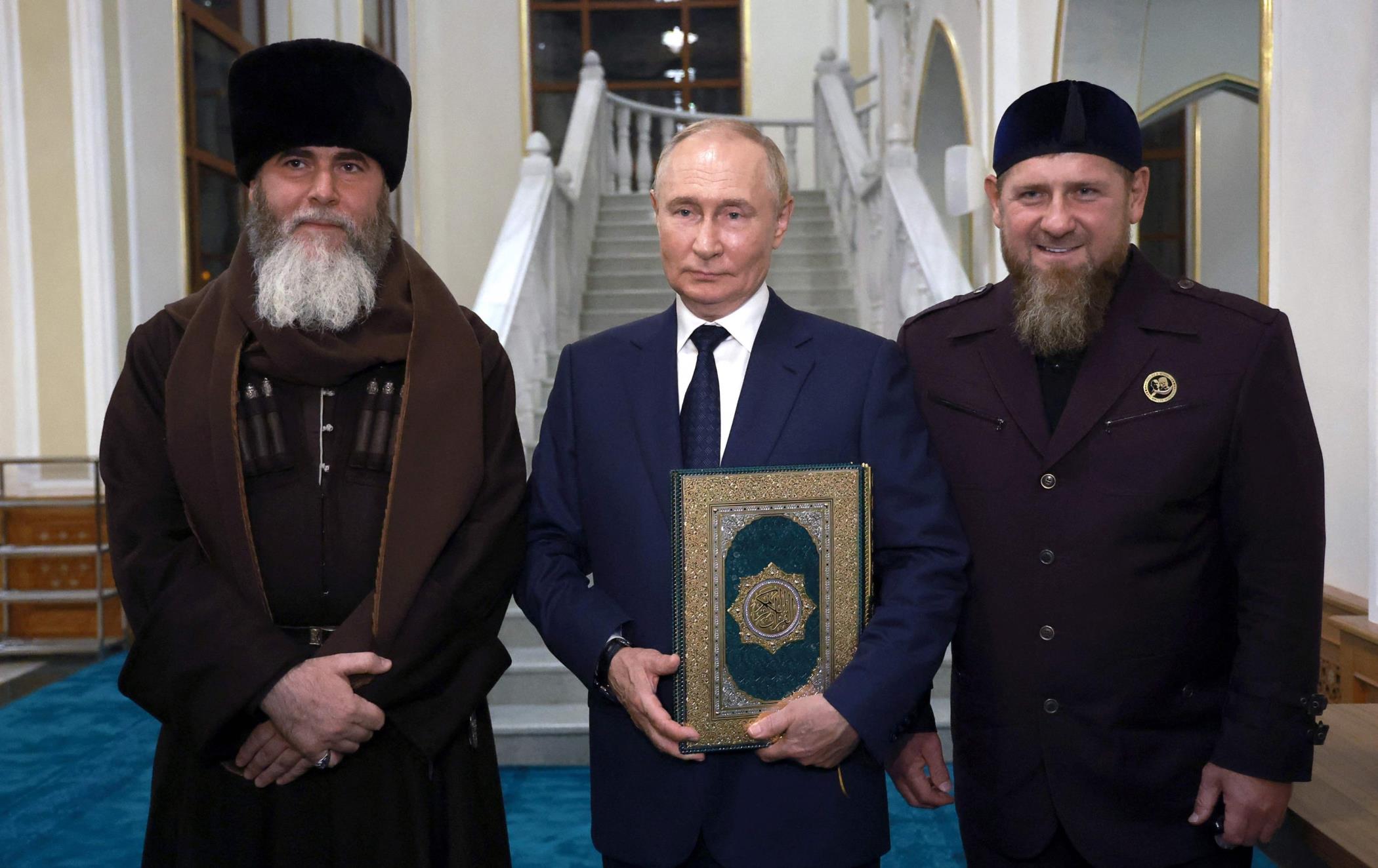 Russia's President Vladimir Putin (C) poses with the head of the Chechen Republic Ramzan Kadyrov (R) and Mufti of Chechnya Sheikh Salah-Hadzhi Mezhiev (L) during his visit to Chechnya in Grozny, Aug. 20, 2024. (Sputnik Handout via AFP)