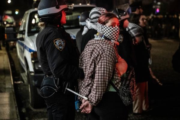 Members of the NYPD detain protesters from the pro-Palestinian protest encampment and Hamilton Hall where demonstrators barricaded themselves inside on April 30, 2024 in New York City.