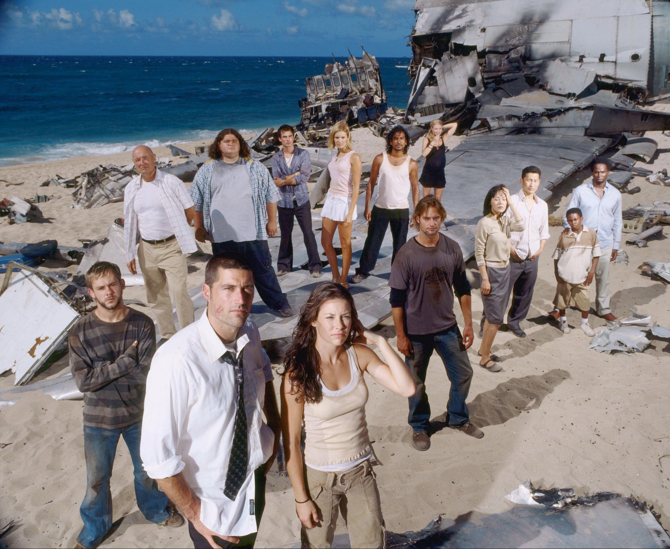 The cast of Lost stood on the beach near a crashed plane